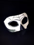 Black and white mask with spiderweb design, perfect for Dia de los Muertos celebrations

