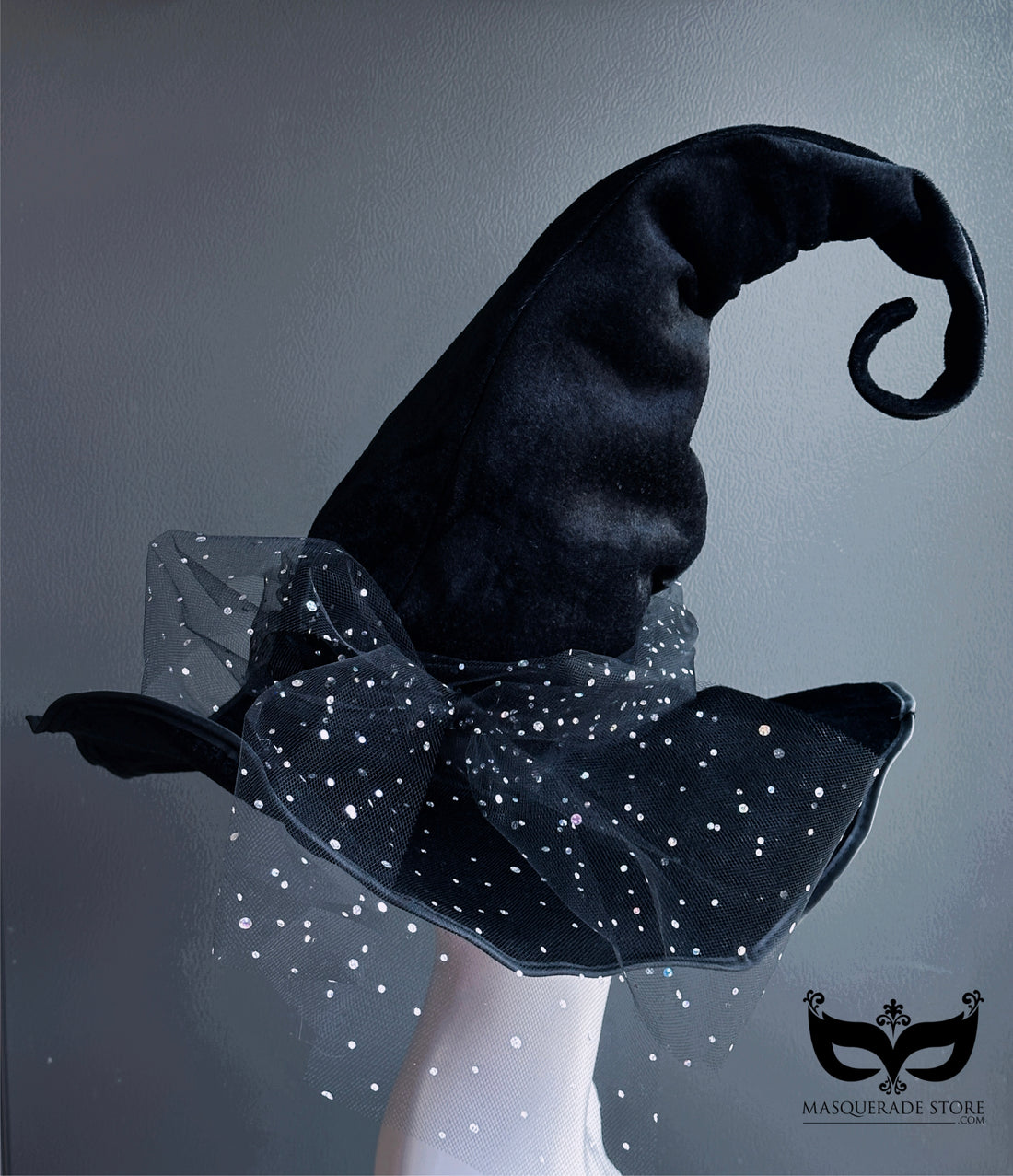 Curled black witch hat with sparkling starry tulle trim for Halloween costumes and witches balls.