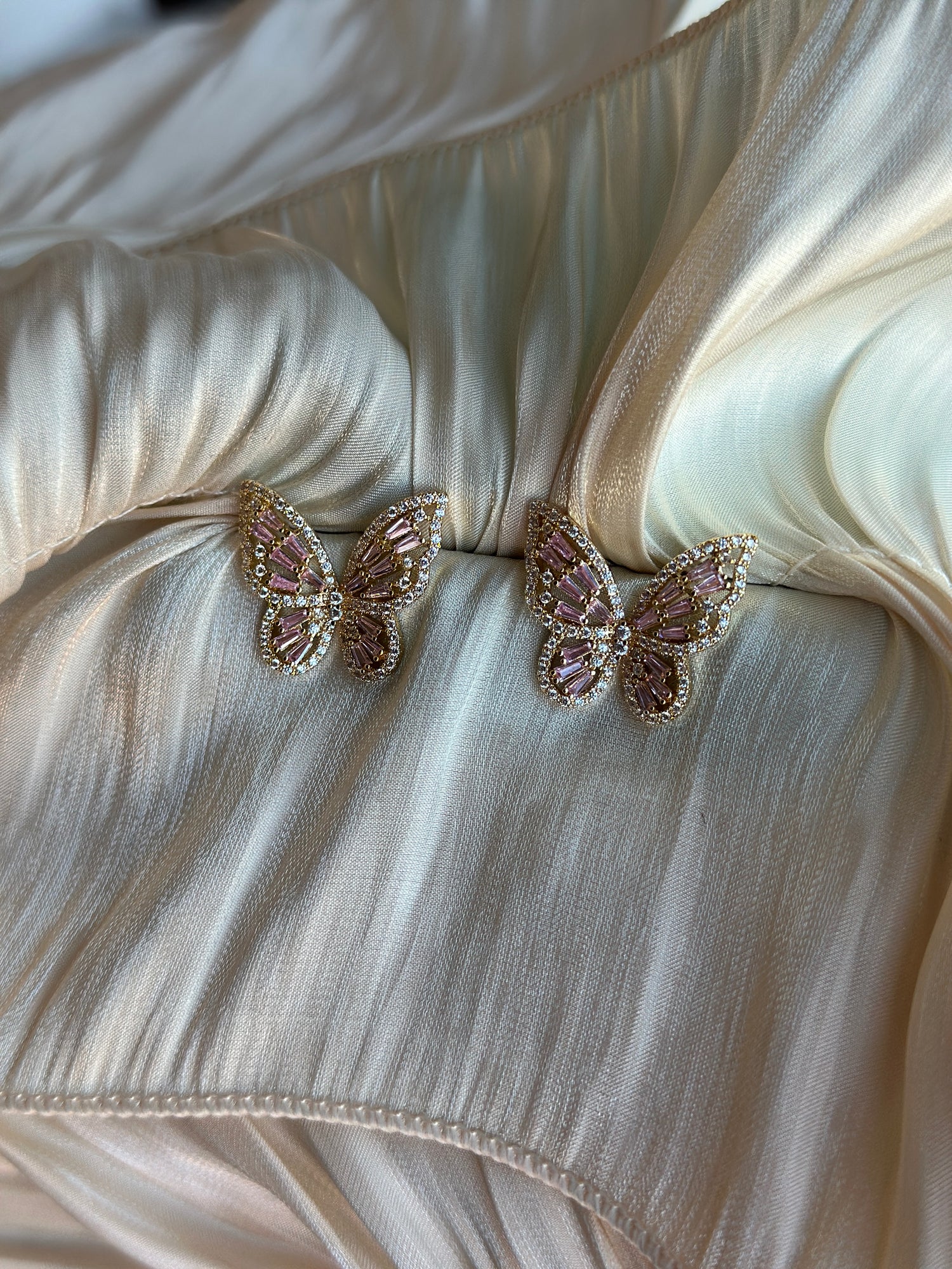 Gold butterfly earrings with pink crystal wings 