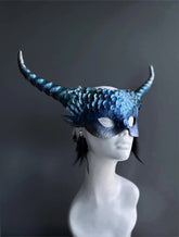 Fantasy blue dragon masquerade mask with curled horns and feather accents.