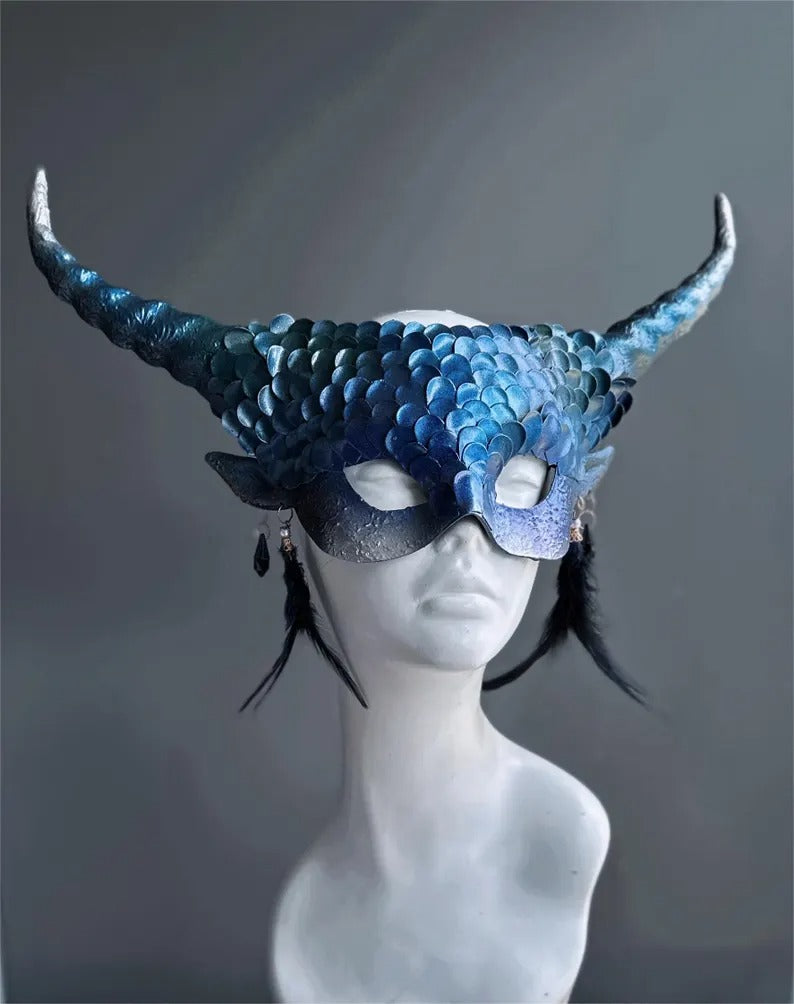 Fantasy blue dragon masquerade mask with curled horns and feather accents.