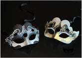 Bulk Venetian masquerade masks with heart-shaped accents, glitter finish, ornate scrollwork, and gold or silver metallic detailing.