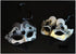 Bulk Venetian masquerade masks with heart-shaped accents, glitter finish, ornate scrollwork, and gold or silver metallic detailing.