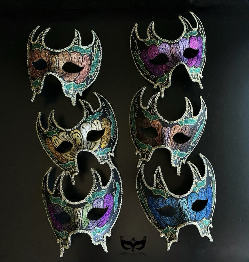 Bulk Venetian crescent masquerade masks with floral artwork, ornate filigree detailing, and gothic-inspired silhouette in assorted jewel-tone colors.