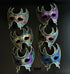 Bulk Venetian crescent masquerade masks with floral artwork, ornate filigree detailing, and gothic-inspired silhouette in assorted jewel-tone colors.