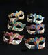 Bulk Harlequin glitter masquerade masks featuring multicolor diamond patterns, Venetian Carnival styling, and decorative scroll detailing.