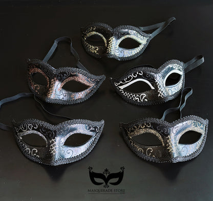 Bulk black Venetian masquerade masks featuring silver and gold metallic scrollwork with elegant half-face designs for masquerade balls and formal events.