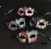 Bulk black Harlequin masquerade masks featuring colorful glitter diamond patterns, crystal accents, and Venetian Carnival styling.