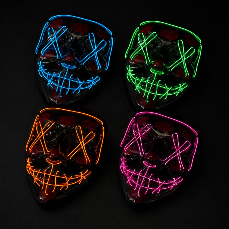Bulk LED purge-style masks with glowing X eyes and stitched smile design in blue, green, orange, and pink illuminated colors for Halloween and cosplay events.