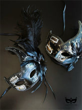 Bulk Venetian masquerade masks with black feather plumes, crystal rhinestones, metallic scrollwork, and elegant crescent silhouettes for masquerade balls and formal events.