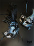 Bulk Venetian masquerade masks with black feather plumes, crystal rhinestones, metallic scrollwork, and elegant crescent silhouettes for masquerade balls and formal events.