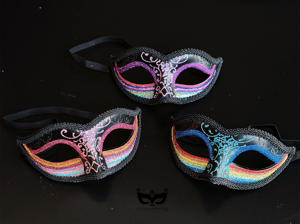 Bulk black Venetian masquerade masks with rainbow glitter bands, colorful filigree detailing, braided trim, and sparkling accents for Pride celebrations and masquerade events.