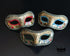 Bulk Venetian masquerade masks featuring antique gold embossed scrollwork, glitter trim, and colorful Harlequin accents for masquerade balls, Mardi Gras, weddings, and large events.