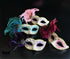 Bulk Venetian masquerade masks featuring decorative feather plumes, metallic finishes, glitter scrollwork, and elegant pastel color combinations.