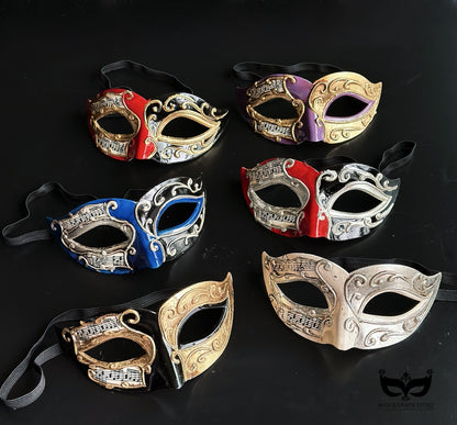 Bulk Venetian Phantom masquerade masks featuring musical sheet artwork, raised baroque scrollwork, and elegant hand-painted finishes in assorted colors.
