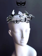 Black and white butterfly headband with satin ribbon tie for fairy costumes and festivals.
