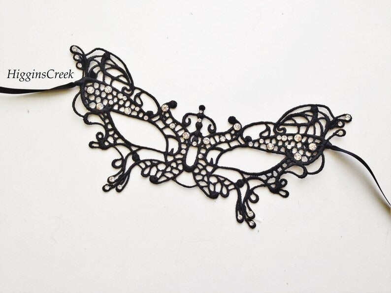 Elegant black butterfly lace masquerade mask with rhinestones for women’s prom, ball, or party.