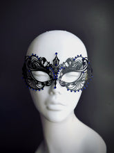 Black filigree metal masquerade mask with blue rhinestones

