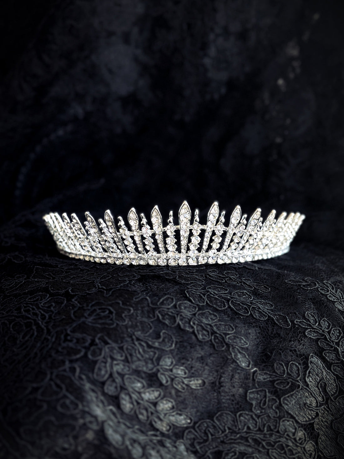 Silver tiara with tall rhinestone spires, perfect for pageants, fantasy looks, or bridal elegance.
