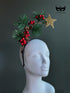 Christmas headband with gold star pine needles red berries and pinecones for holiday outfits and winter parties