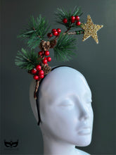 Christmas headband with gold star pine needles red berries and pinecones for holiday outfits and winter parties