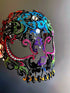 Rainbow glitter sugar skull masquerade mask with rhinestones, designed for Mardi Gras, Carnival, and Day of the Dead.