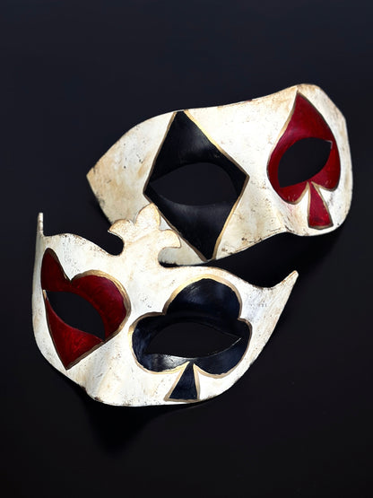 Couples masquerade mask set with black and red card suit symbols over the eyes and gold details.