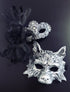Silver lace womens masquerade mask with black feathers, paired with a black silver men&
