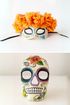 Couples sugar skull masks with orange rose crown and floral skull design.