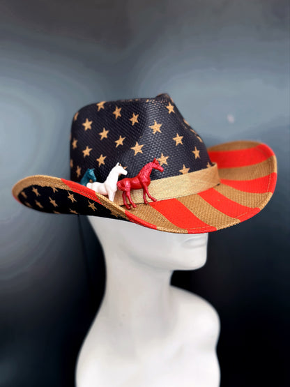 Cowboy hat with a USA flag design featuring stars, stripes, and painted horses in white blue and red.