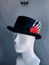 Men’s Day of the Dead hat with black felt base, red rose, and skeletal hand accent, perfect for Día de los Muertos celebrations.