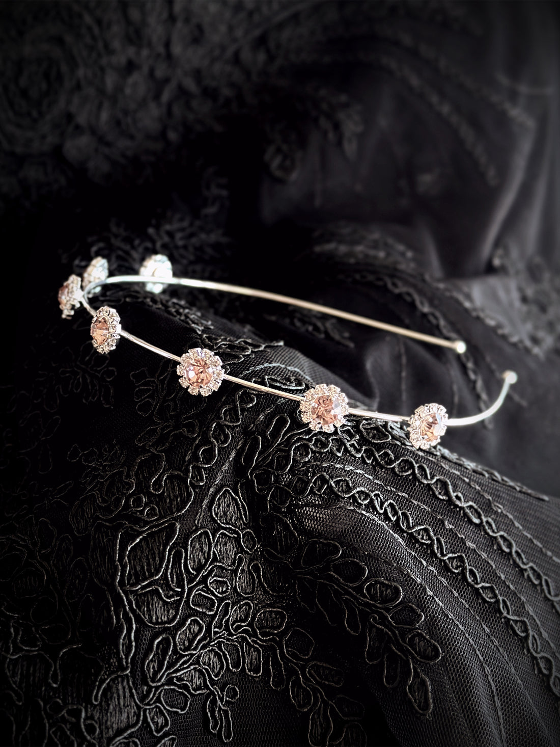 Elegant silver headband with shimmering rose-shaped crystals