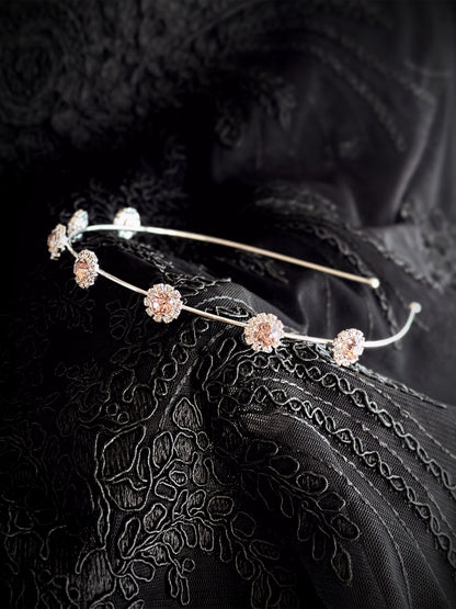 Elegant silver headband with shimmering rose-shaped crystals