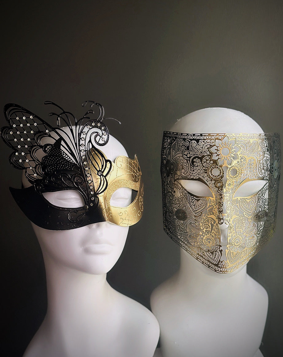 Black and gold couples masquerade masks featuring a butterfly motif and ornate full-face detailing


