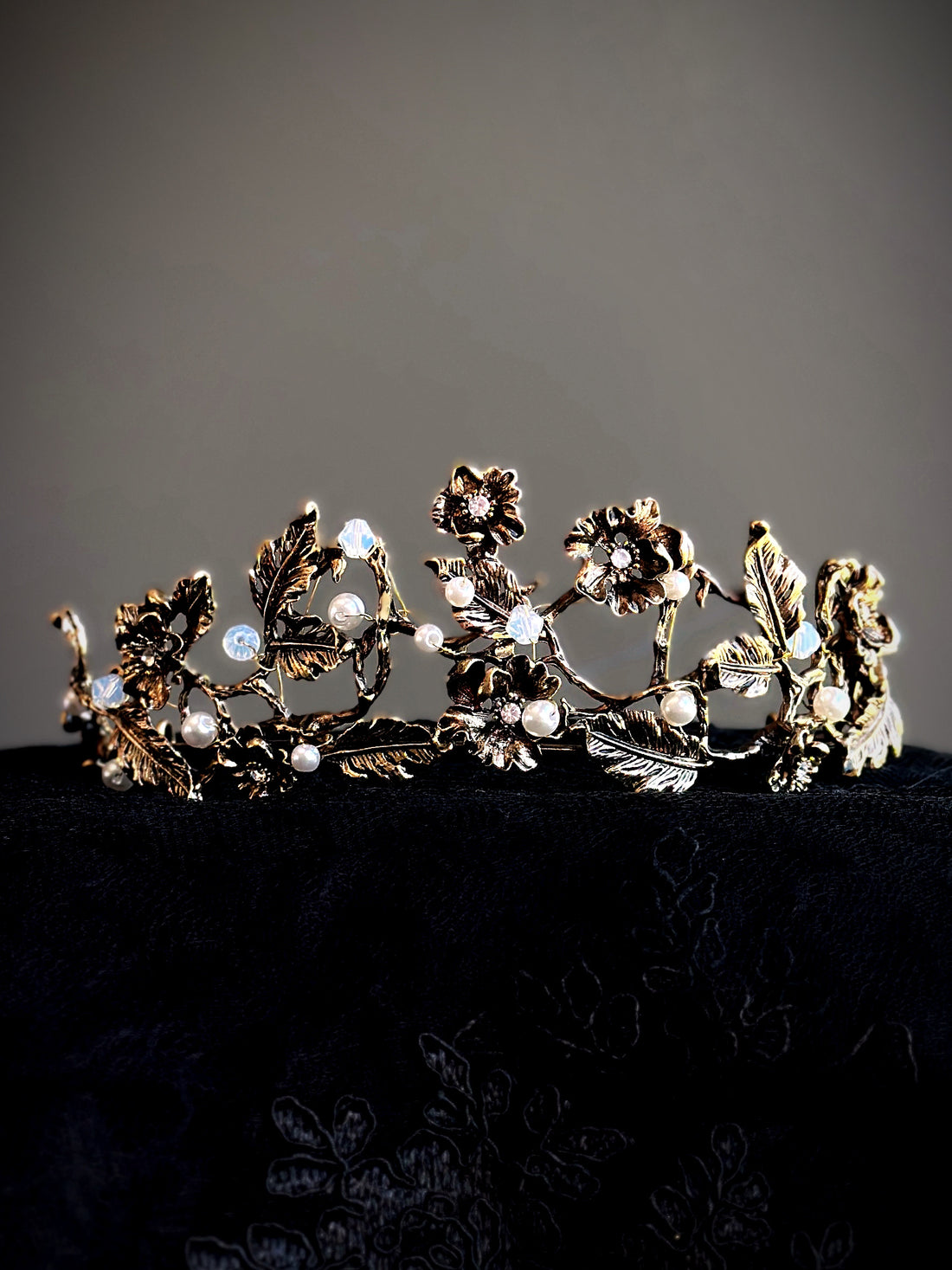Gold floral crown with vine, pearl, and crystal detailing.