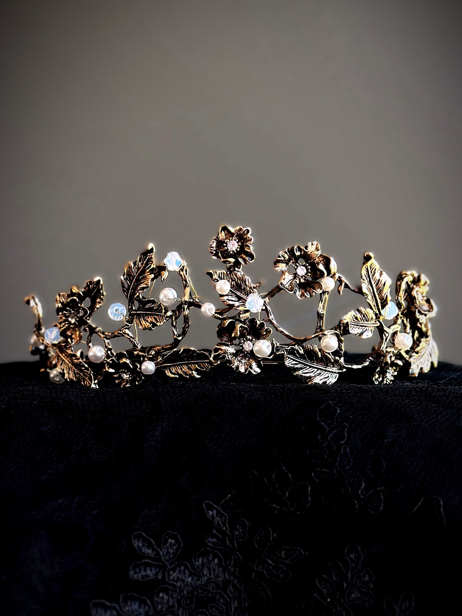 Gold floral crown with vine, pearl, and crystal detailing.