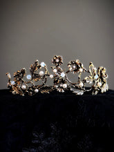 Gold floral crown with vine, pearl, and crystal detailing.