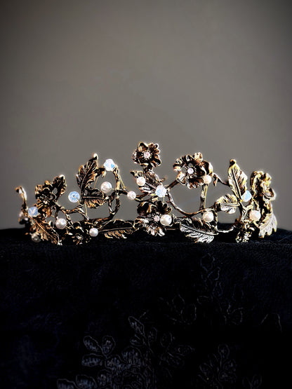 Gold floral crown with vine, pearl, and crystal detailing.