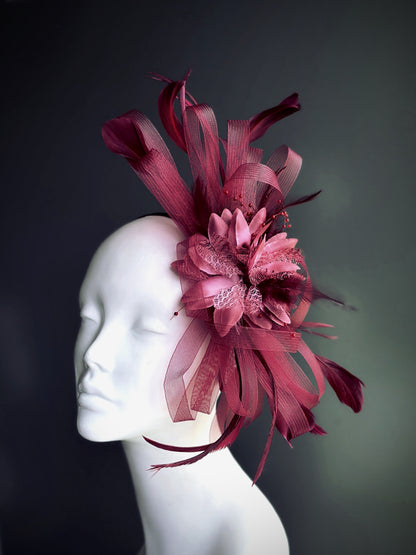 wine red fascinator hat with sculpted tulle ribbons and feather accents