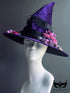 Botanical purple witch hat with dried floral bouquet and black ribbon, ideal for Halloween costume