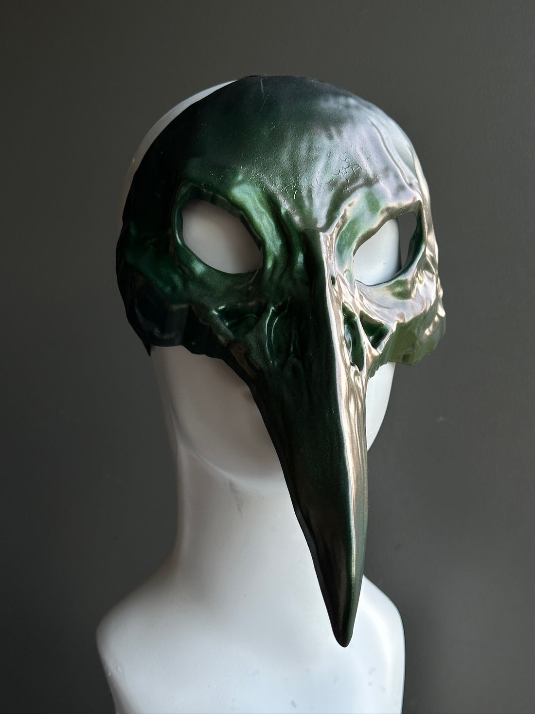Forest green gothic plague doctor masquerade mask with long beak and metallic finish, ideal for Halloween or cosplay