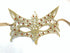 Fox-inspired lace mask in gold with detailed design and red stones, tied with satin ribbons for a luxurious finish.