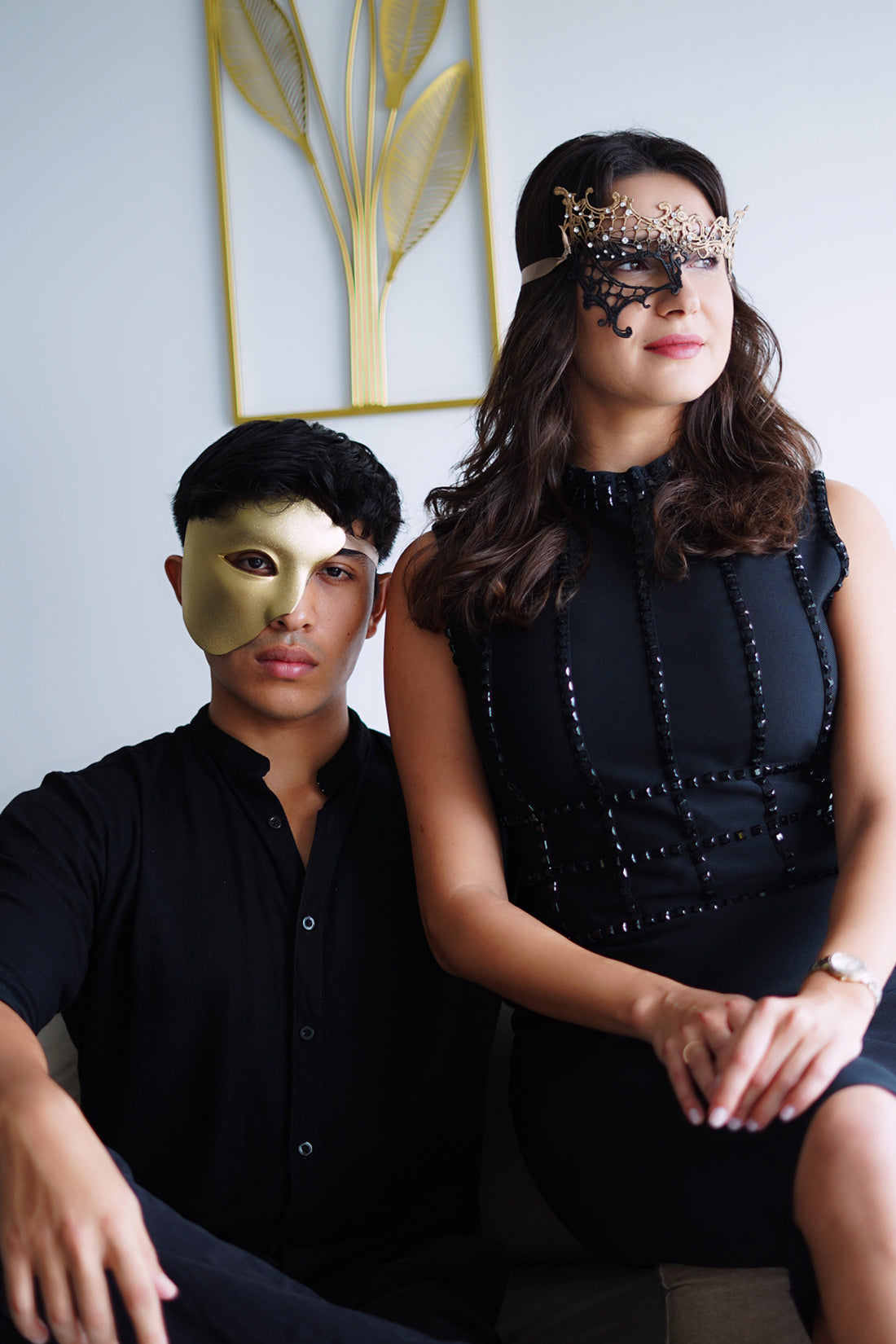 His and hers masquerade mask set in black and gold.