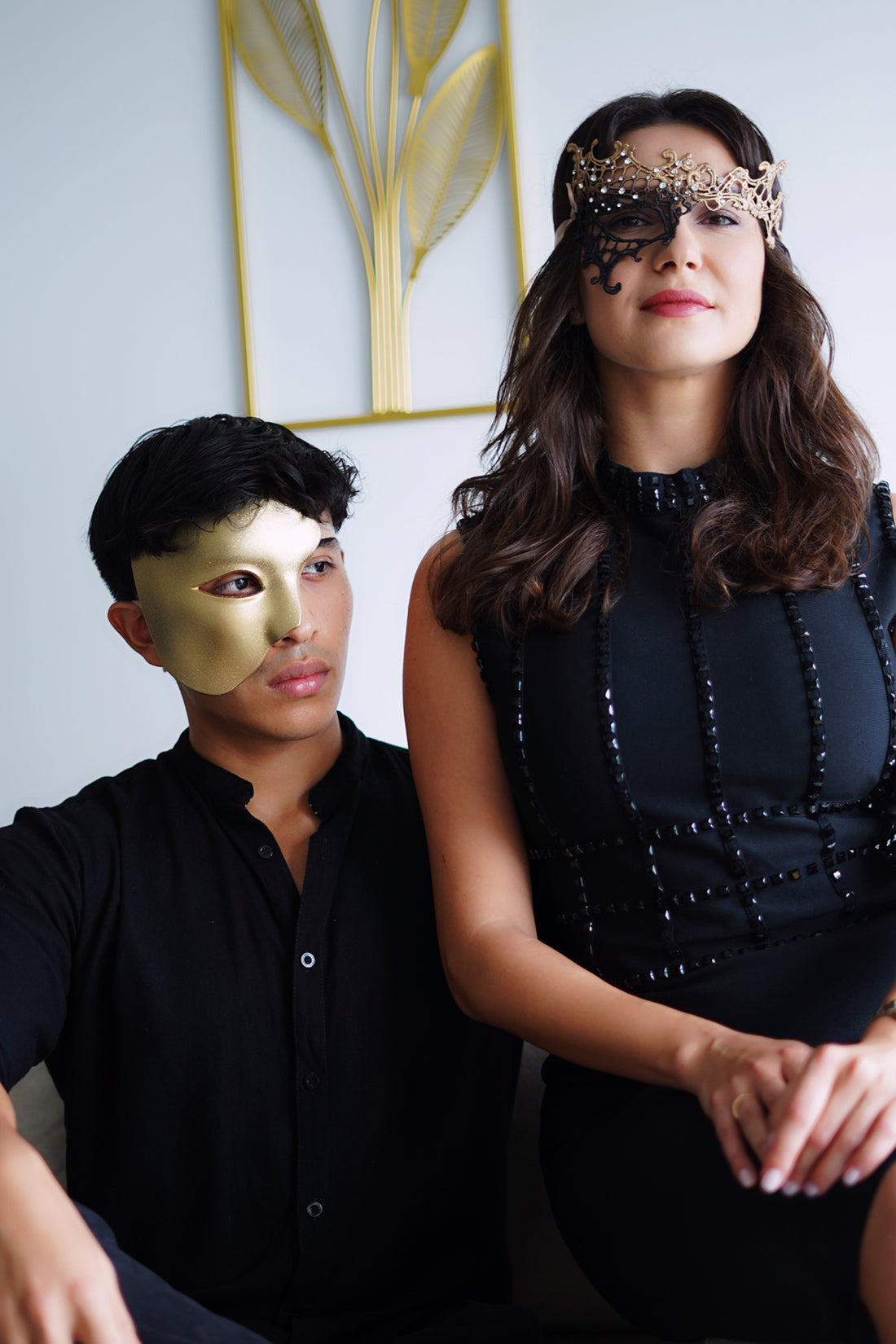 His and hers masquerade mask set in black and gold.