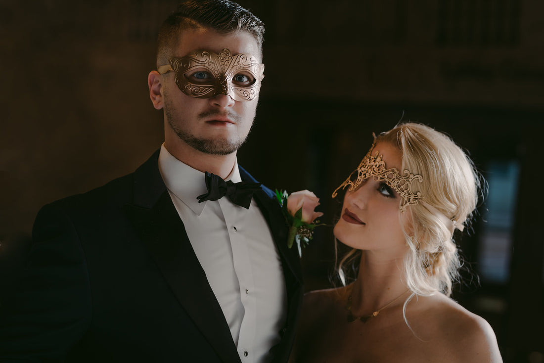 Elegant gold couples masquerade masks—metallic Venetian style for him and filigree lace design for her.