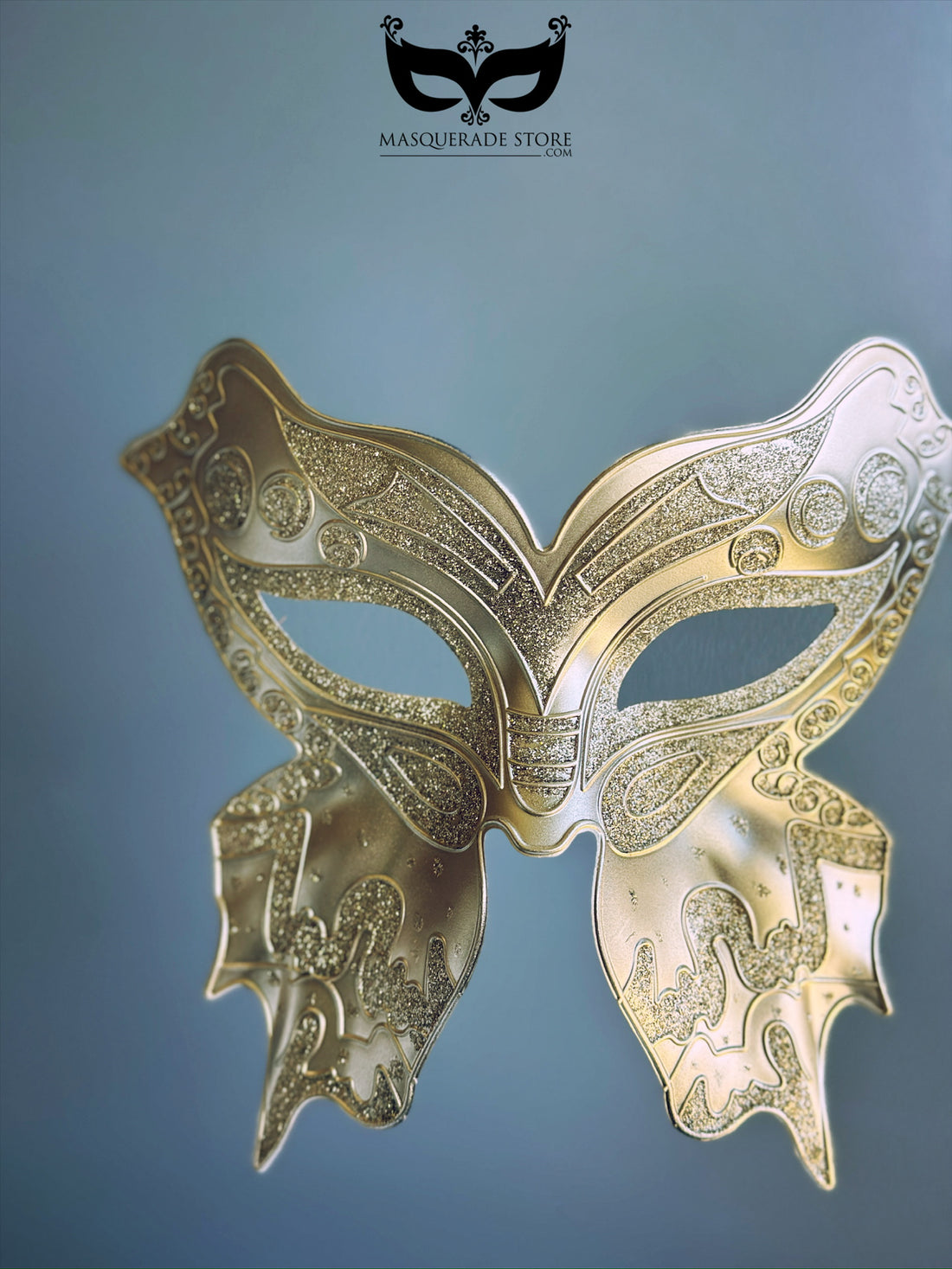 Gold butterfly masquerade mask with plague-inspired elongated design and glitter filigree, perfect for Venetian balls and Halloween events.