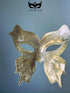 Gold butterfly masquerade mask with plague-inspired elongated design and glitter filigree, perfect for Venetian balls and Halloween events.