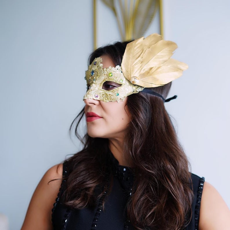 Elegant gold lace masquerade mask with feathers and rhinestones, Venetian-style women’s accessory
