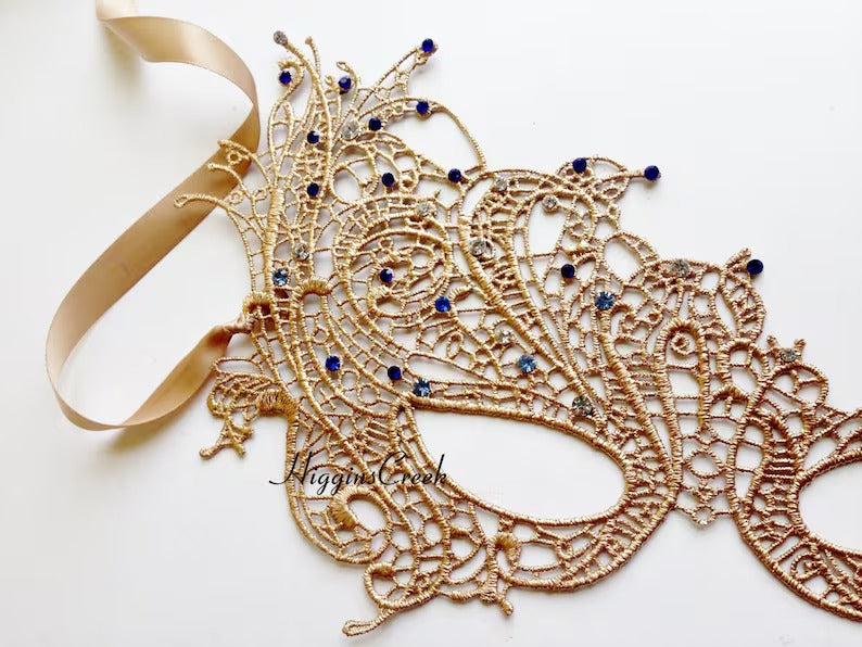 Gold lace masquerade mask with blue gemstone accents, Venetian lace mask for proms, balls, and elegant costume events.