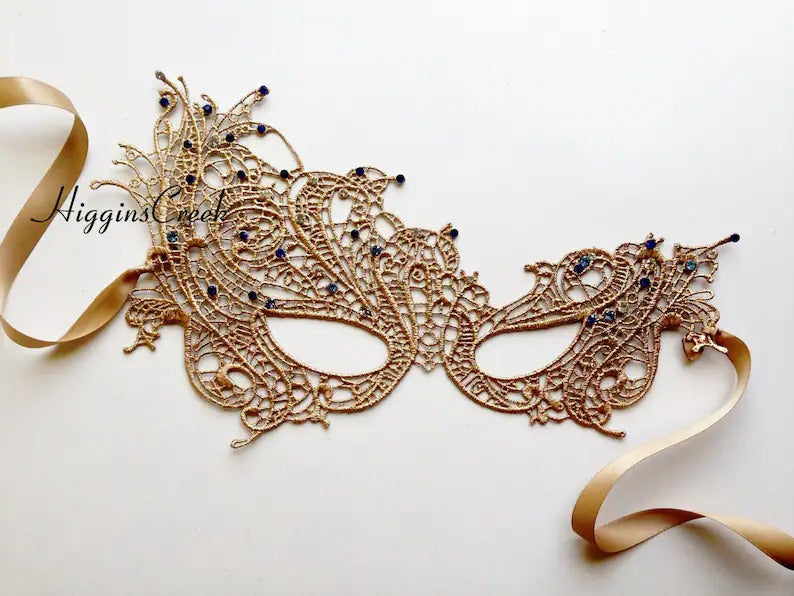 Gold lace masquerade mask with blue gemstone accents, Venetian lace mask for proms, balls, and elegant costume events.
